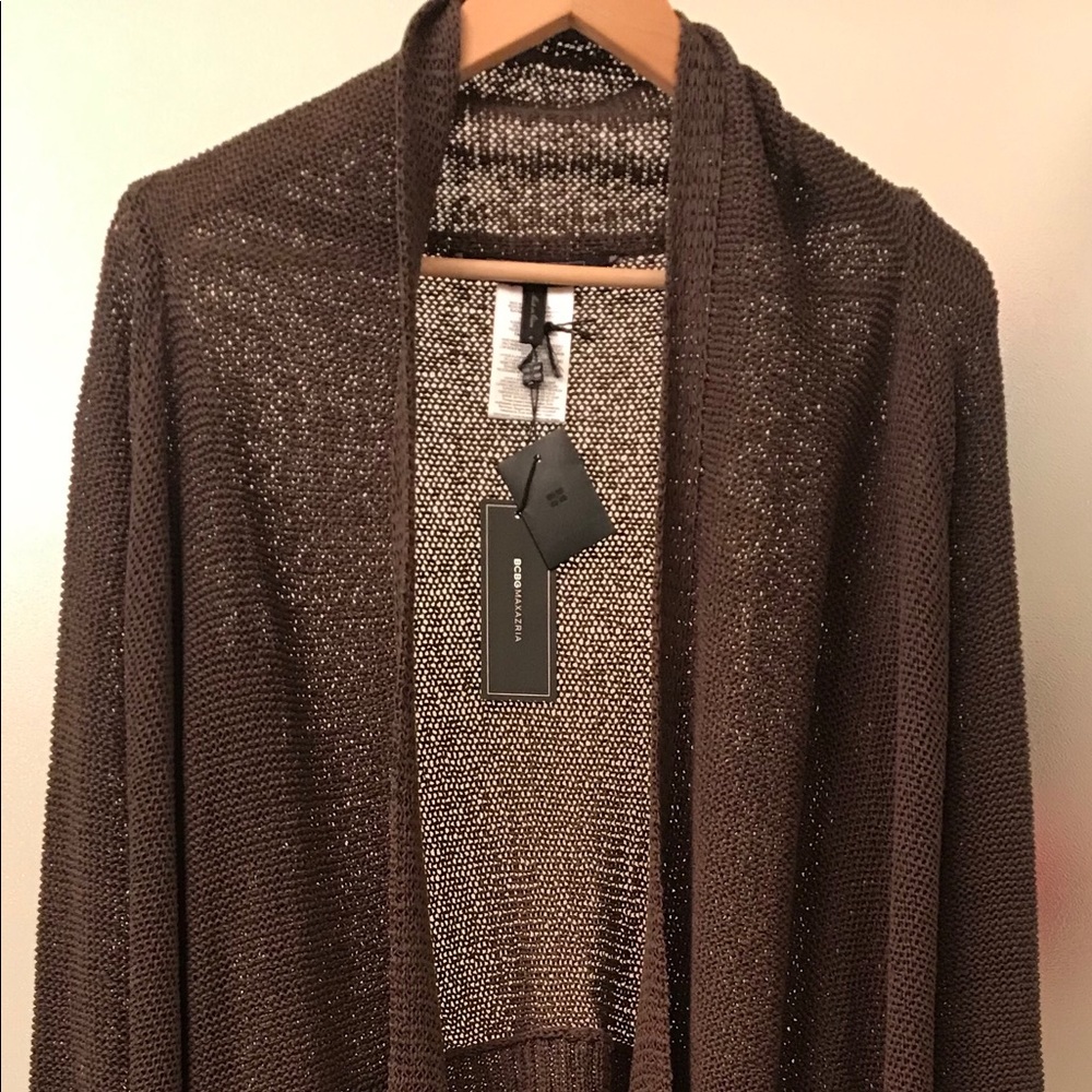 Stylish BCBG sweater with fringes. Brand new. Size small. Brown